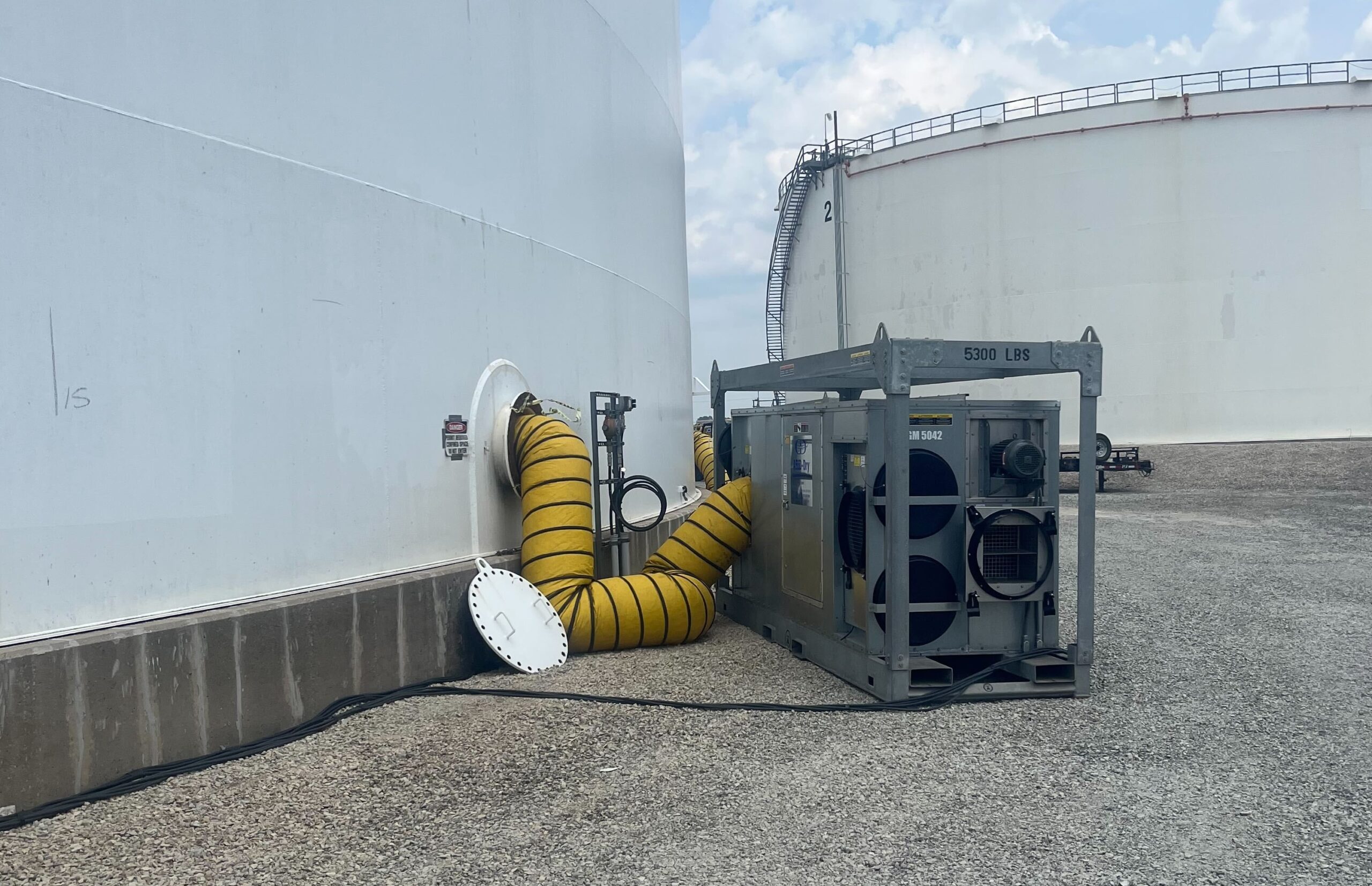 Dehumidifier providing climate control on industrial painting tank